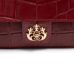 BOLSA ANNE EM COURO CAIMAM CARMIM OURO