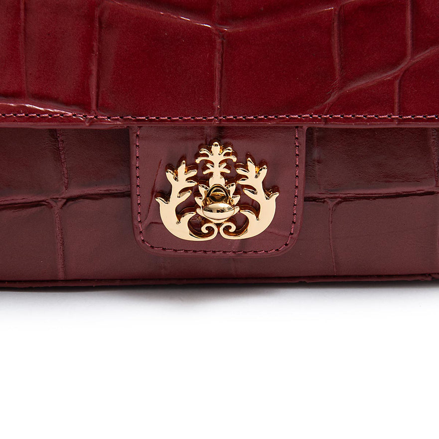 BOLSA ANNE EM COURO CAIMAM CARMIM OURO